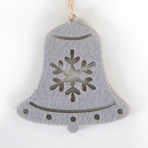 Detailed view of bell-shaped grey felt Christmas ornament with snowflake cutout