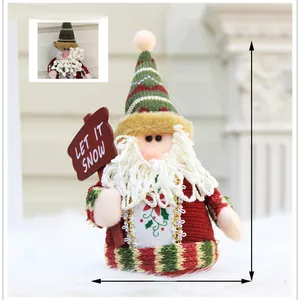 Detailed view of an 18cm Santa plush toy with a Let It Snow sign on white fur