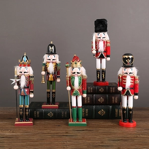 Set of five traditional wooden nutcracker figures in classic red and green Christmas colors