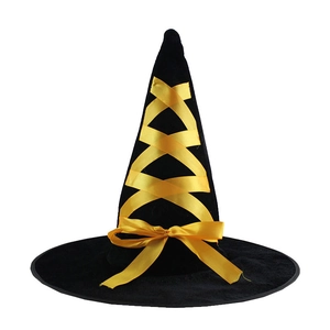 Detail of black velvet Halloween witch hat with bright yellow ribbon and decorative bow