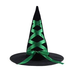 Detail of classic pointed black witch hat with emerald green satin ribbon and bow