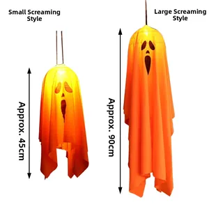 Size comparison of two orange hanging ghost decorations with screaming faces in 45cm and 90cm