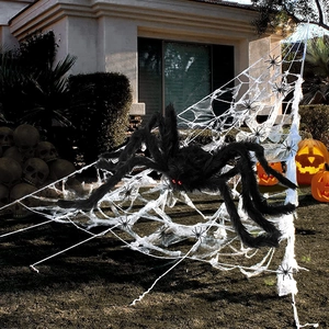 Giant black plush spider with red eyes and white triangular web Halloween yard decoration