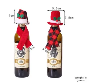 Detail of red and black buffalo plaid Christmas wine bottle hat and scarf set decor