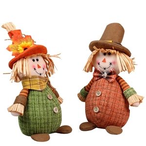 Set of two harvest scarecrow gnomes with maple leaf and tall hats for fall decor