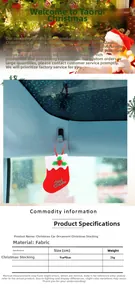 Car interior view of red Christmas stocking ornament hanging from the rearview mirror
