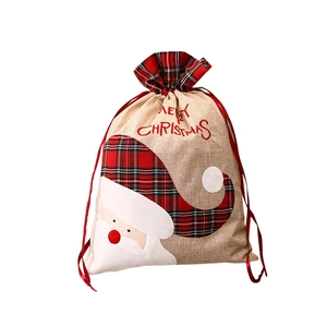 Burlap Christmas gift bag with Santa Claus applique and red plaid trim details