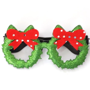 Lunettes de Noël en forme de couronne avec nœuds rouges à pois et paillettes vertes