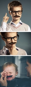 Detailed view of children wearing realistic fake mustaches in brown and black colors