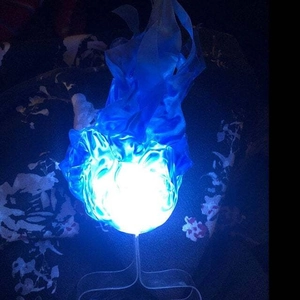 Detailed view of a blue floating fireball light with silk-like flame texture