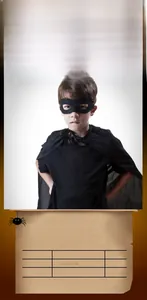 Close-up of black Halloween Zorro set including eye mask and cape for kids costume