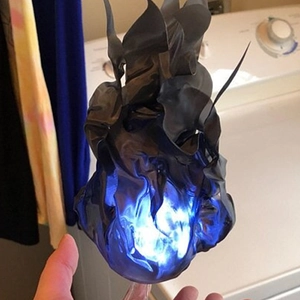 Close-up of a blue magic floating fireball light effect for Halloween cosplay decor
