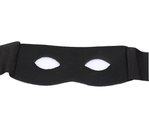 Close-up of black fabric eye mask for Halloween parties with tied ribbons on white background