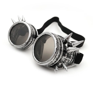 Detail view of silver steampunk goggles with spiked frames and black elastic headband