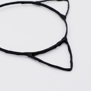 Detailed close-up of the ribbon wrapping on the black cat ear shaped metal headband
