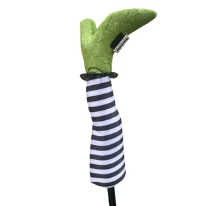 Halloween witch leg stakes with green glitter boots and black white striped patterns