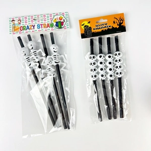 Detail of Halloween crazy straws featuring skull designs and flexible black tubing