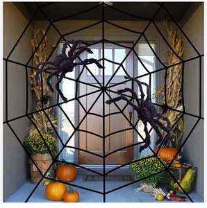 Halloween porch decoration with giant black rope spider web and two large plush spiders
