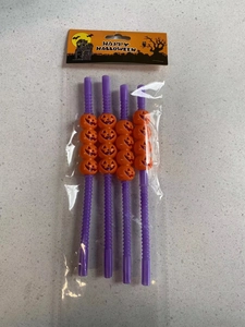 Set of 4 Halloween straws with orange jack-o'-lantern decor on purple wavy stems
