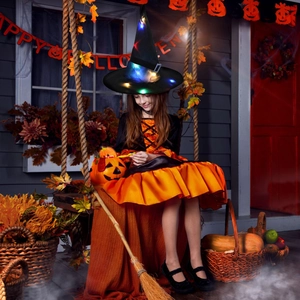 Girl wearing glowing LED black witch hat with colorful lights for Halloween decoration