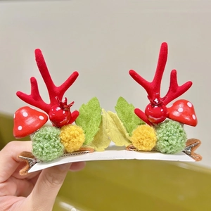 Christmas reindeer antler hair clips with red mushroom and berry festive hair accessories