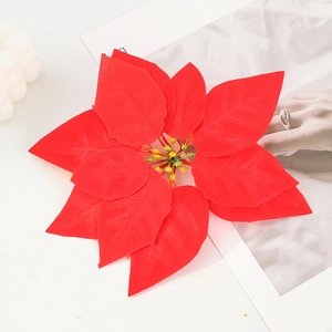 Artificial red poinsettia flower head for Christmas decor with realistic petal textures