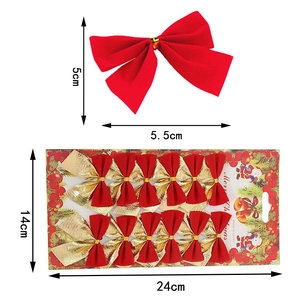 Detail view of 12pcs red flocked Christmas bows with gold ties in holiday packaging