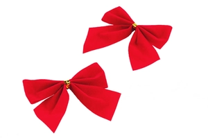Close-up of red velvet Christmas bows with gold metal buckles for DIY wreaths