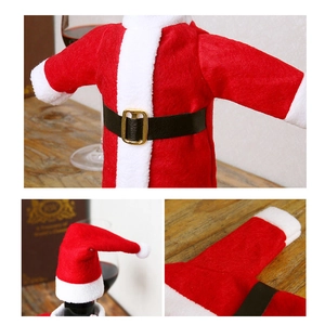 Detail of Christmas wine bottle cover with flannel jacket and mini hat table decor