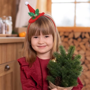 Detail eines roten Weihnachtshat-Haarreifs mit grünen Pailletten und goldener Glocke