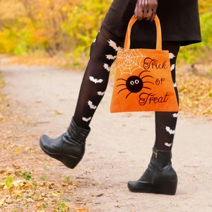Orange Halloween non-woven treat bag with spider print and Trick or Treat text