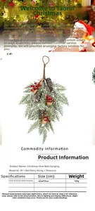 Detailed view of snowy Christmas pine wall swag with pinecones and red berries