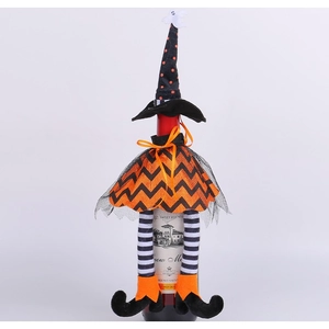 Halloween witch wine bottle cover with orange polka dot hat and striped legs decoration