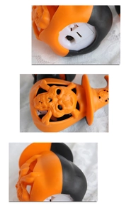 Détail de lanterne citrouille d'Halloween montrant le boîtier de piles et l'interrupteur