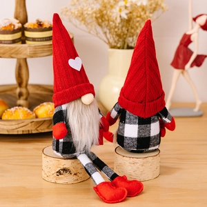 Christmas gnomes with red knit hats and white heart details on birch wood base