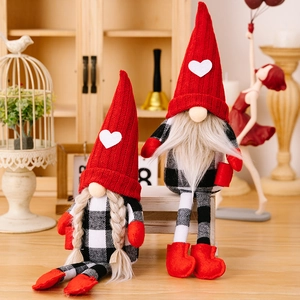 Pair of Christmas gnome plush dolls with red heart hats and black-white plaid outfits