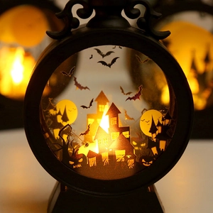 Detail of Halloween LED lantern showing silhouette of castle, bats and pumpkins