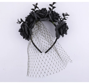 Close-up of black roses and mini skulls on a Halloween veil headband for costume parties