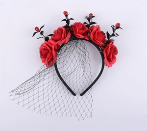 Detail of Halloween rose headband with red skulls and a black mesh gothic veil