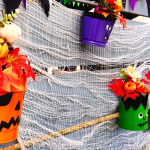 Halloween hanging buckets with pumpkin, bat, and monster designs for spooky party decor