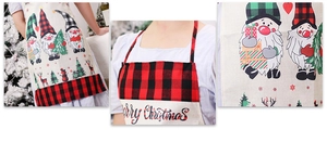 Detail of Christmas gnome apron featuring red-black plaid stitching and festive graphics