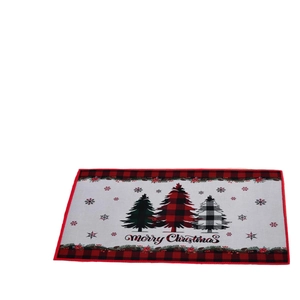 Christmas mat with red plaid border featuring three trees and Merry Christmas text