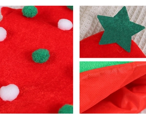 Detail of red felt Christmas hat with colorful plush balls and green star decoration