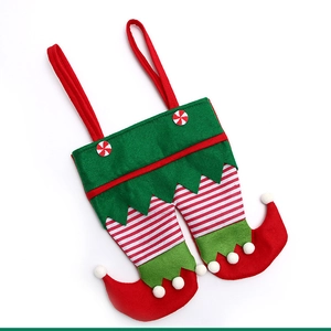 Christmas elf pants gift bag with stripe legs and pom-poms for holiday party candy storage