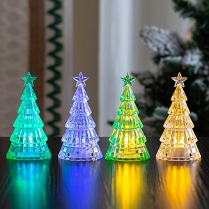 Set of four glowing LED crystal Christmas trees in multiple colors for festive desk decor