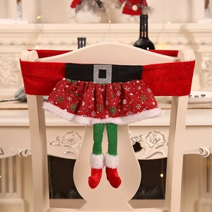 Christmas elf skirt chair cover with red fabric and green legs for festive dining decor