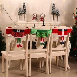 Three festive Christmas elf chair back covers featuring red skirts and green elf legs