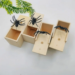 Handcrafted wooden prank spider scare box with sliding lid and realistic black spider toy