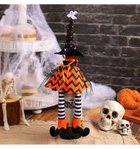 Halloween wine bottle cover featuring a witch hat and striped long legs on a rustic table