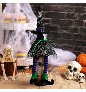 Detailed view of Halloween wine bottle cover with witch hat and striped spider legs